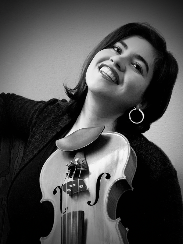 black and white photo of woman playing the violin