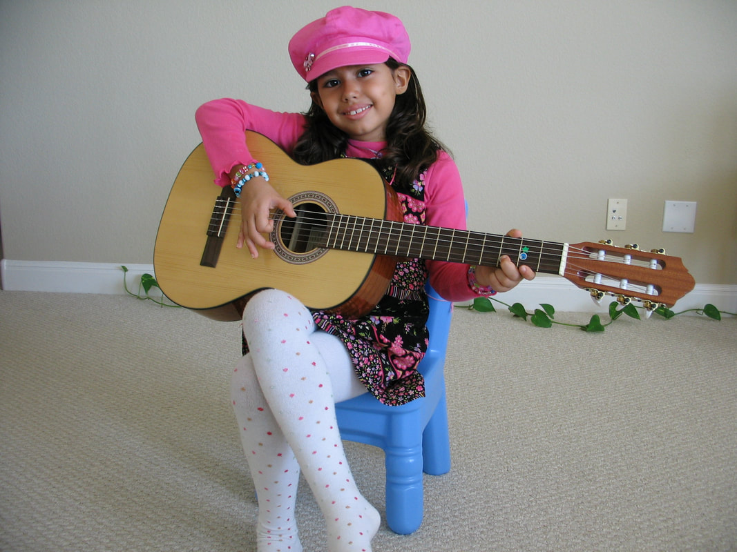 Young student holding guitar